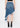 Noend Denim Mandy asymmetrical denim skirt with uneven hem, styled with casual top and accessories for a trendy look.