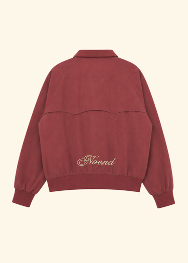 A dusty rose red cropped jacket with a collar, shown from the back. It features a wavy seam detail across the upper back and the word 'Noend' embroidered in a light beige script near the lower back.