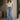 Upcycled Noend Denim high-rise baggy wide-leg jeans with distressed details and relaxed fit, shown on a model.