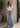 Upcycled Noend Denim high-rise baggy wide-leg jeans with distressed details and relaxed fit, shown on a model.