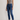 Woman wearing a gray tank top and Noend blue classic fit
jeans against a plain background