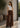 Noend Denim Dina high waisted wide corduroy pants in dark brown with a wide, baggy fit, shown on a model.