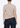 Cream-colored Supima cotton deep V-neck tee by Noend Denim, featuring a relaxed fit and soft fabric, ideal for casual tops.